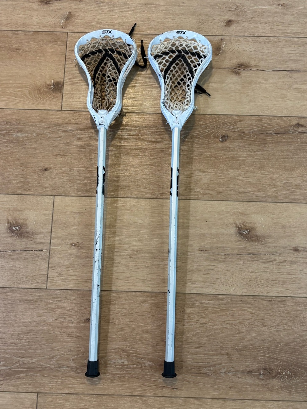 Two STX White Lacrosse Sticks